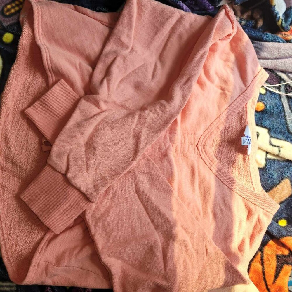 peach sweatshirt